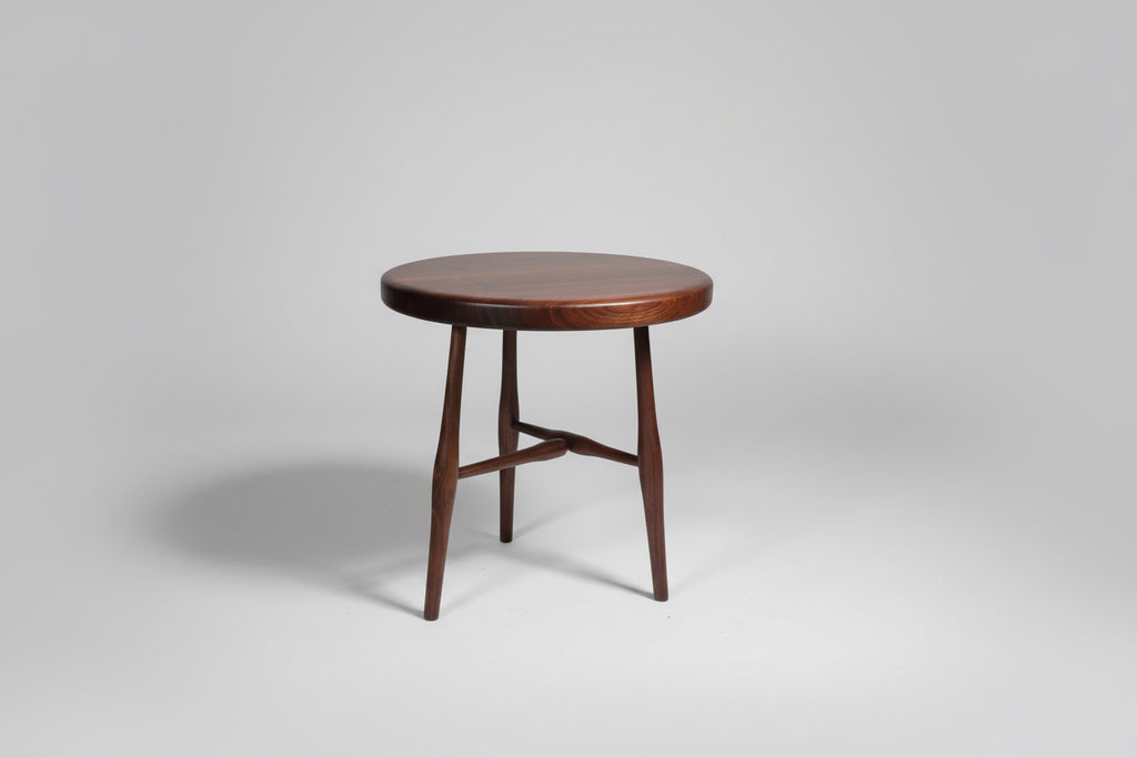 Wooden round table on a gray background