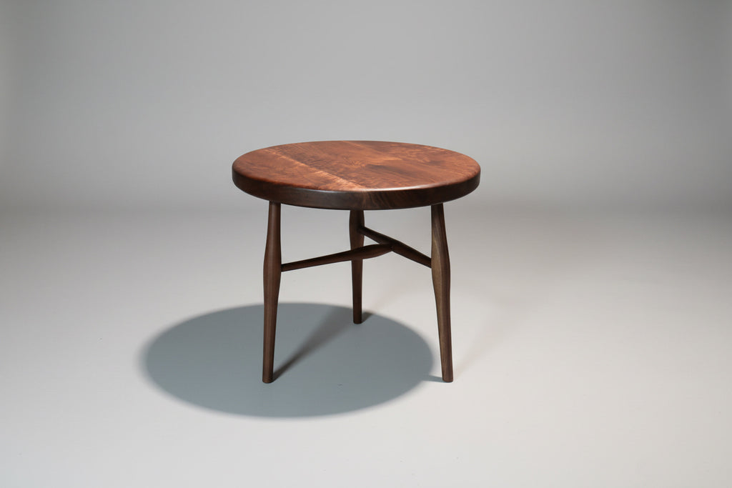 Wooden table with a dark finish on a gray background