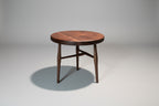 Wooden table with a dark finish on a gray background