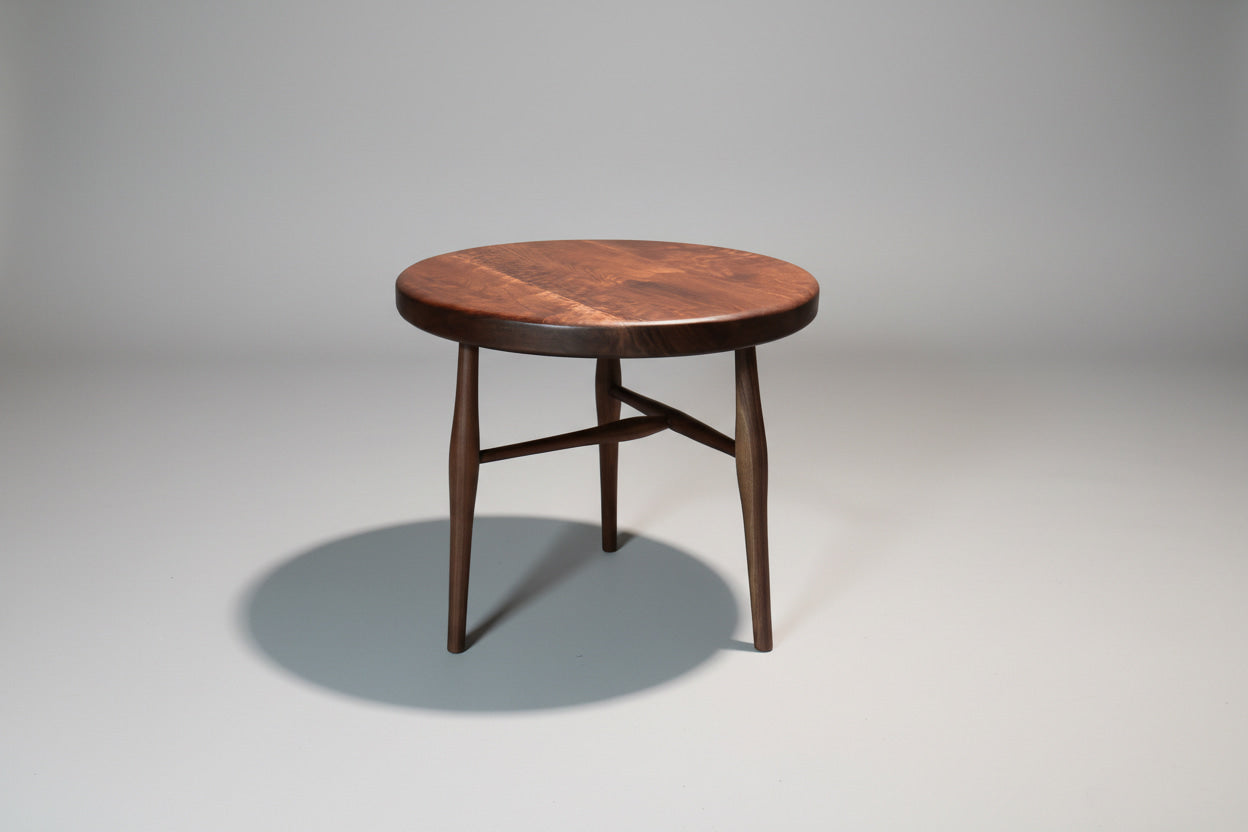 Wooden table with a dark finish on a gray background