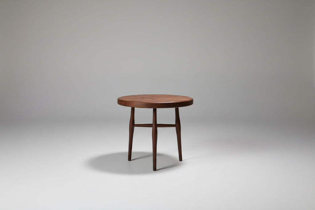 Wooden side table on a plain background