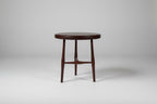 Round wooden stool on a white background