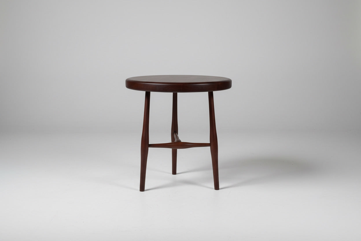 Round wooden stool on a white background