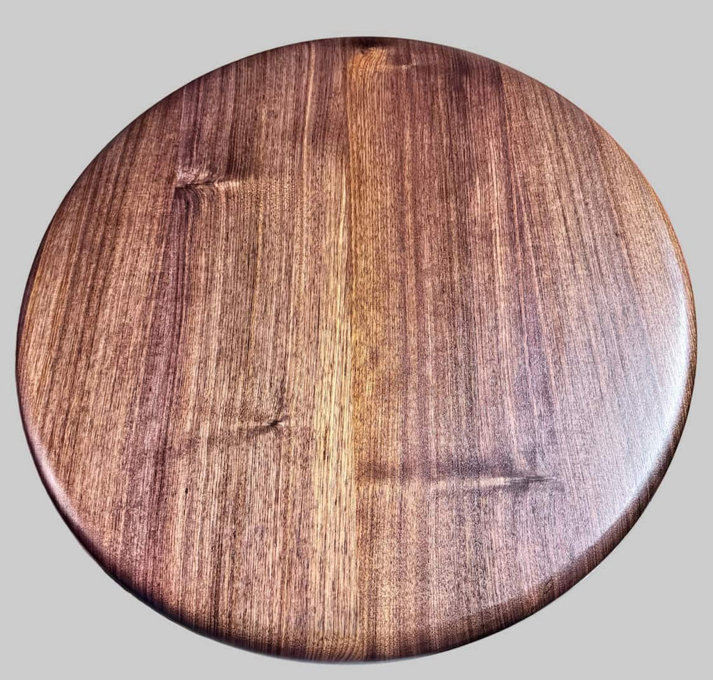Round wooden table top on a gray background