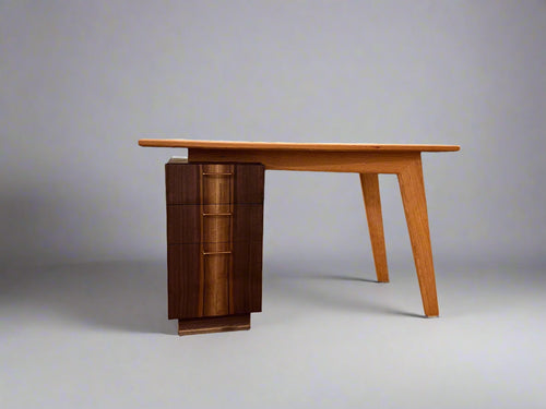 Wooden desk with a bookshelf against a gray background