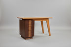 Wooden desk with a cabinet on a gray background