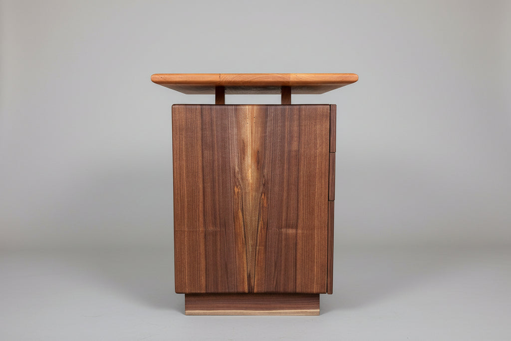 Wooden cabinet with a wooden top on a gray background