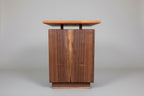 Wooden cabinet with a wooden top on a gray background
