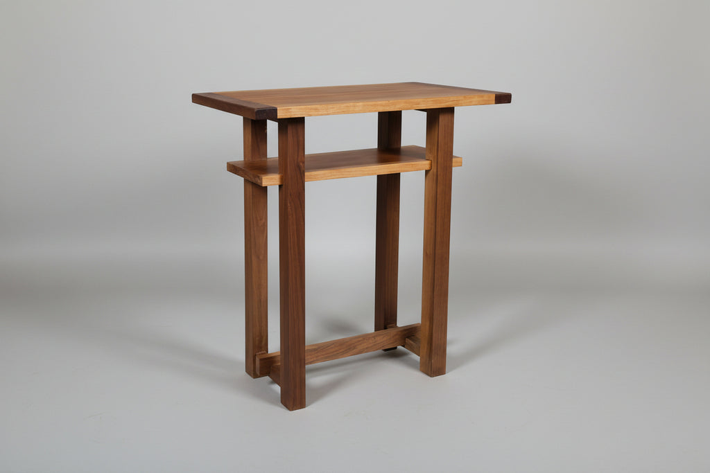 Wooden side table on a gray background