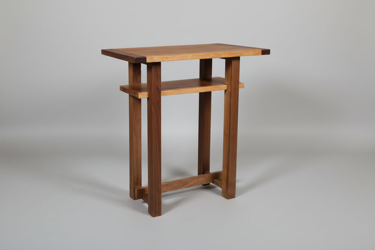 Wooden side table on a gray background